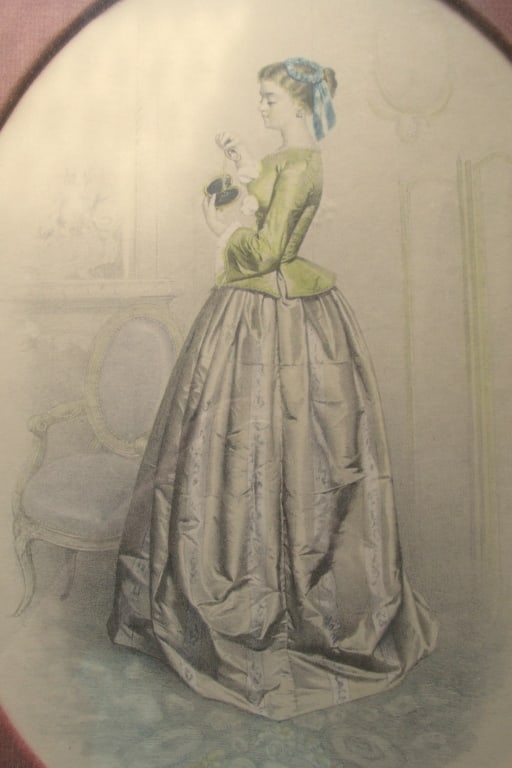 The Blue & Yellow Dress - Victorian: The Yellow Dress A Victorian lady is a beautiful blue & yellow gown.Framed in pink oval fabric. Print Type: Lithograph Origin: American Dimensions: 12 x 16" Frame: Gilt wood Subject: Victorian