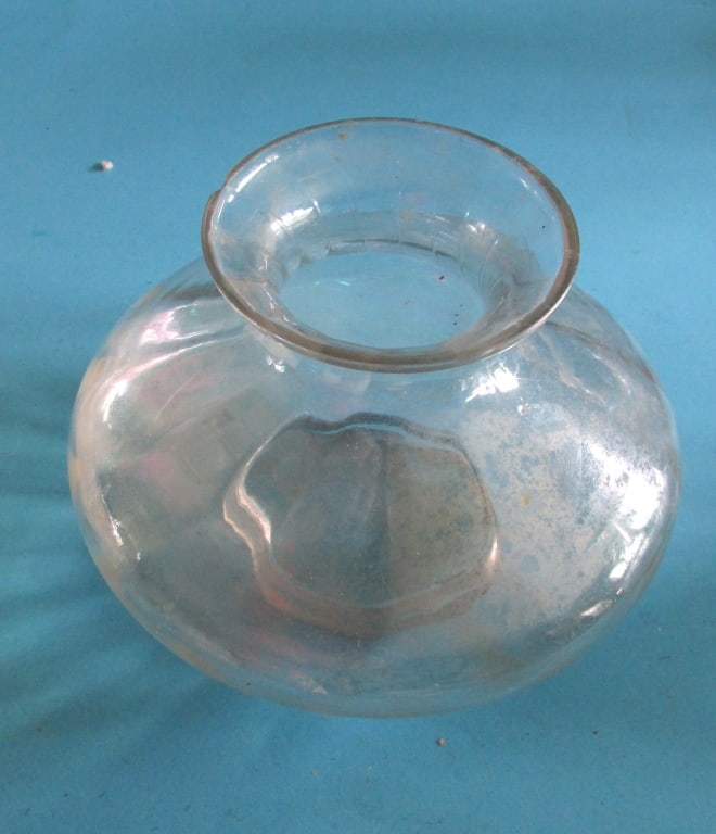 Iridescent Glass Bowl: This bowl is of unknown origin and date. Date/Period: 19th/20th century Type: Iridescent Dimensions: H. 5" L. 6 1/2" Provenance: Hill House Glass Collection Condition Report Small chip on rim else