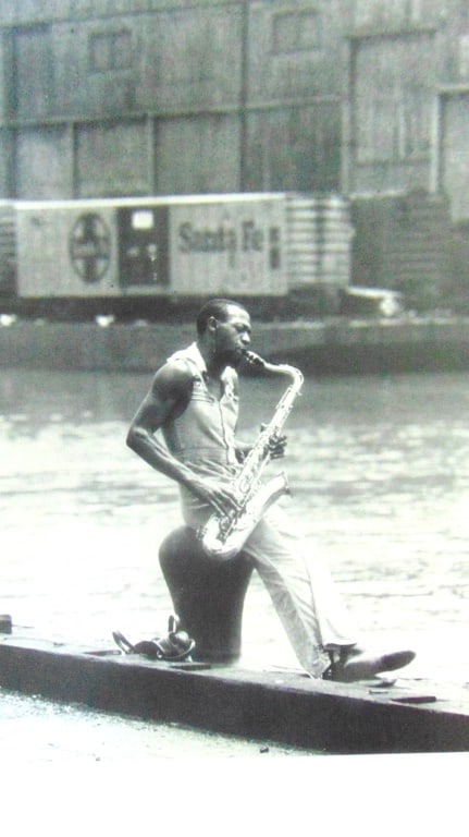 Saxophone Player on a Hudson River Pier (1 of 2)