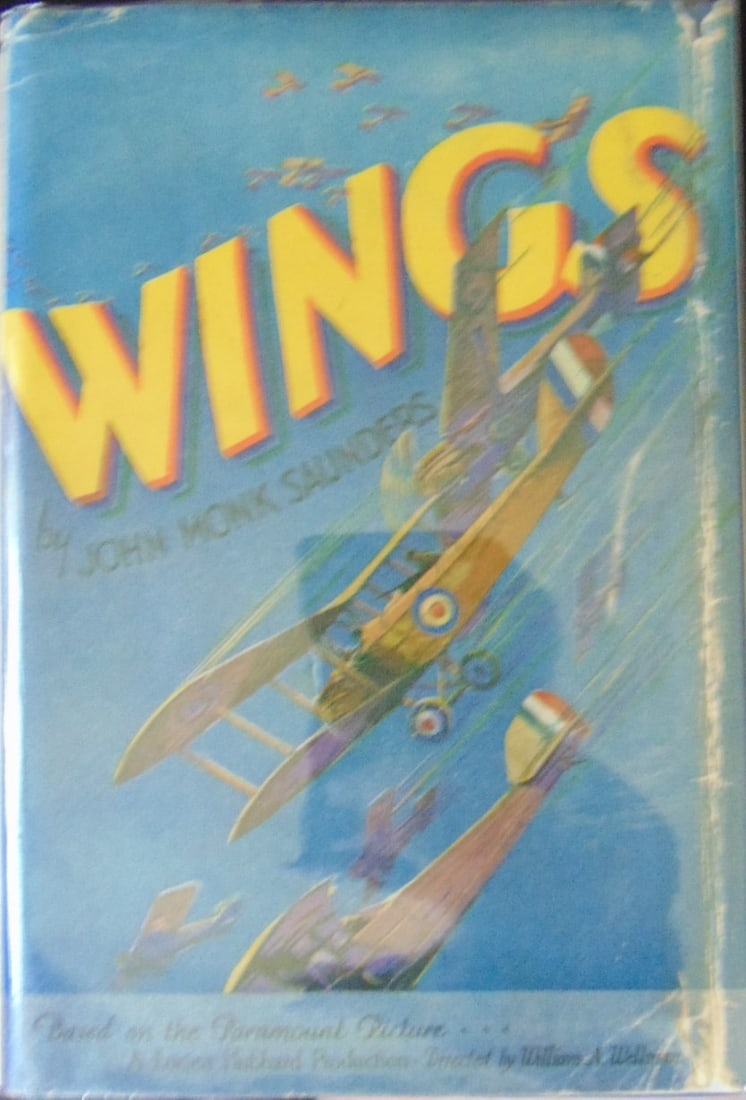 Wings - Paramount Picture Photoplay w/ DJ: Wings - Based on the Paramount Picture - A Lucien Hubbard Production Directed by William A, Wellman All Photos Present. Dust wrapper is in clear archival sleeve. Wings" is a silent war film directed b