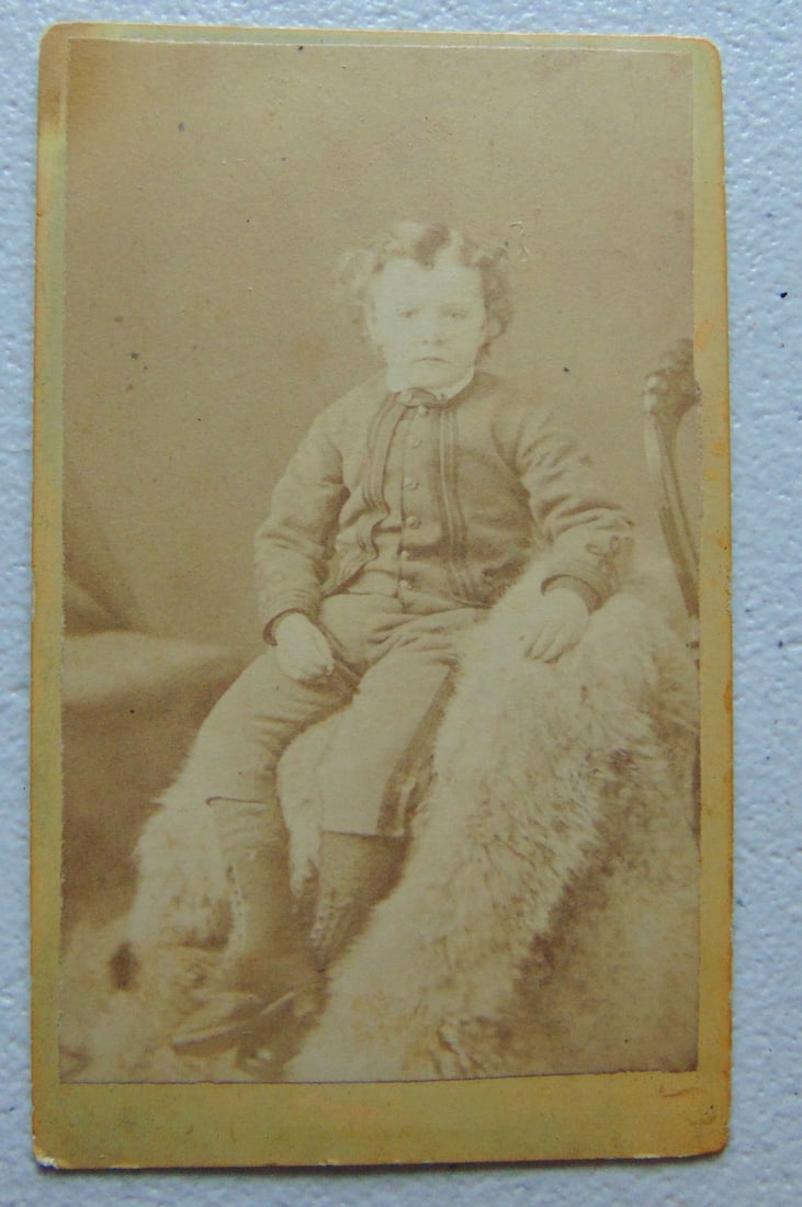 Rare CDV of Boy in Uniform on Fur Blanket: Carte de Vista (CDV) of Boy in Uniform on Fur Blanket THOMPSON and SUN Address: George Street Peterborough Ontario" Research has shown that the firm of R Thompson and S