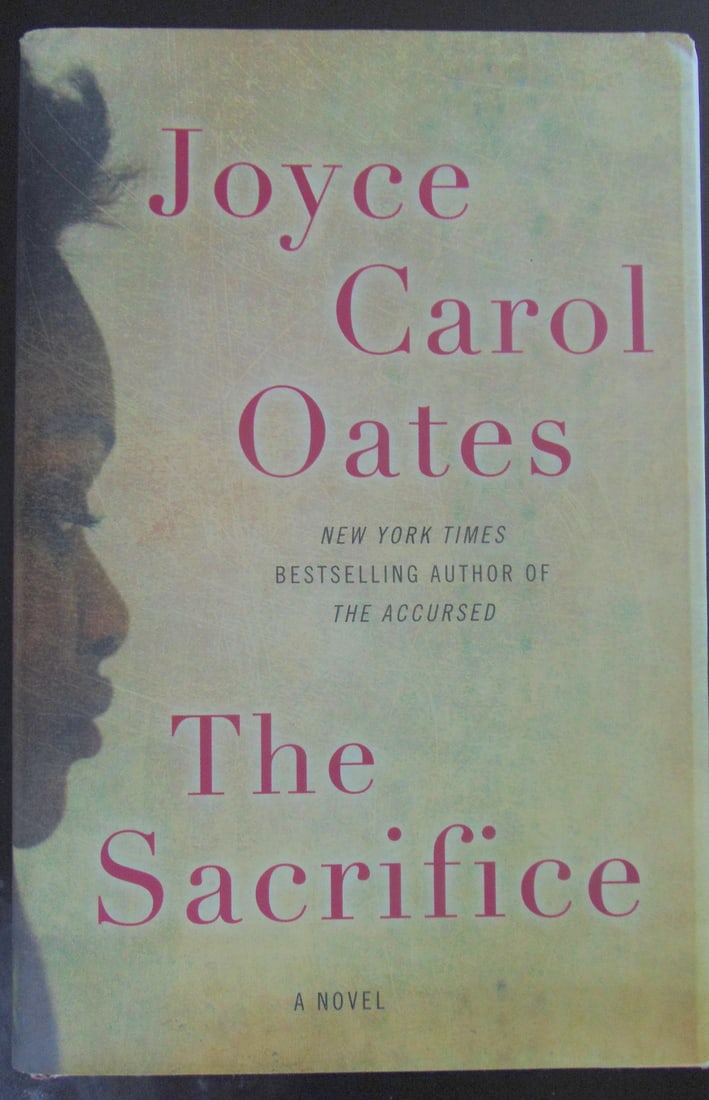 The Sacrifice - Joyce Carol Oates 1st edition: The The Sacrifice The Sacrifice is a 2015 novel by Joyce Carol Oates. Set in blighted urban New Jersey in the 1980s, it follows a young Black woman, Sybilla, who is discovered in a degraded condition 