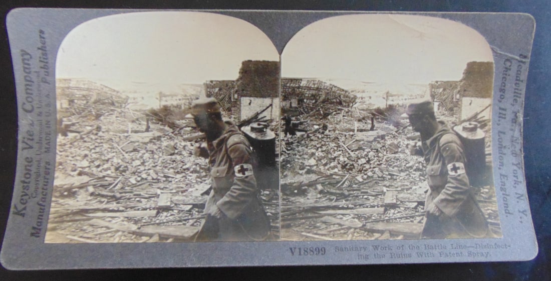 Santiary Work on the Battle Line: Santiary Work on the Battle Line Disinfecting the Ruins with Paten Spray Photographer: Keystone Subject: 19th/20th century Views Medium: Stereoview St