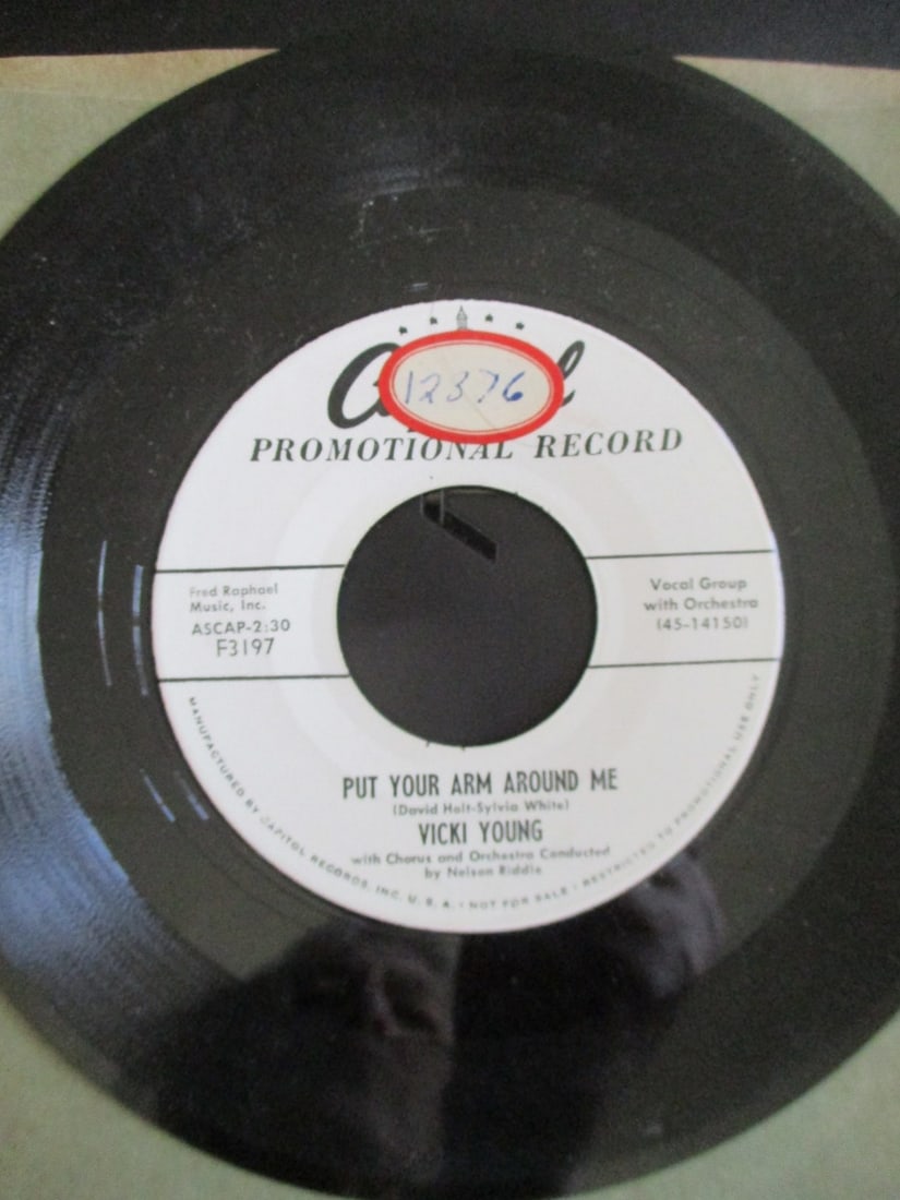 Promotional Record by Vickie Young: Promotional Record - Not for resale. Put Your Arm Around Me & I Can't Get You Out of My Mind - Capitol 3197. This was her 13th record she produced. Label: Capit