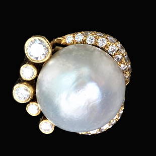 18k Yellow Gold Ring with a 16mm Pearl: Massive 16mm cultured pearl and 18k yellow gold diamond ring with 32 modern brilliant cut round diamonds set in an unusual tube setting. Marked La Triomphe jewelry. Diamonds weigh .83 CTTW and are of