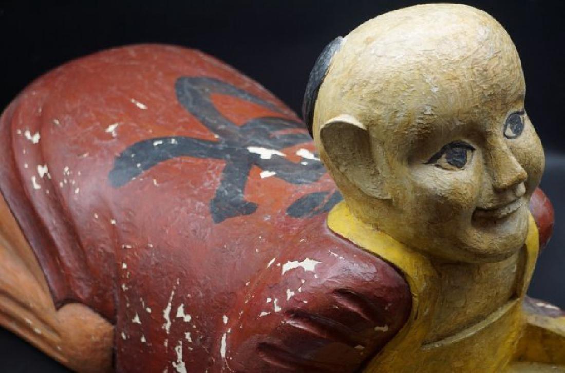 Chinese Antique Painted Opium Pillow: Chinese wooden painted head pillow depicting Asian child kneeling.Measures 24" long and 15" tall and 10" wide