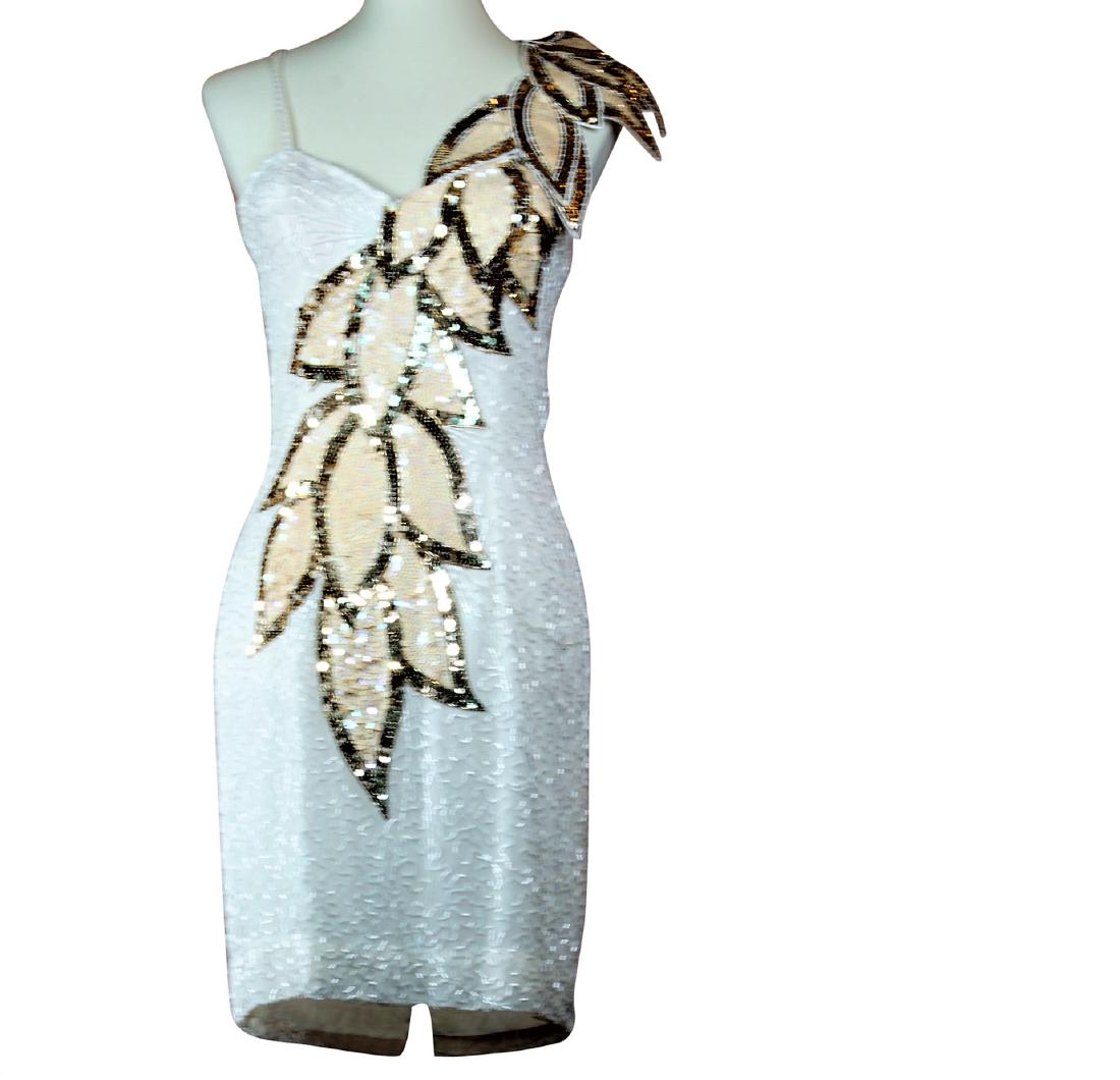 Swee Lo Silk Midcalf Camisole Dress: Swee Lo 100% silk mid calf camisole pencil dress with a v neckline, sequin and bead embellishment and asymmetrical bellflower pattern from the shoulder to the front. Indicated size 8 Measures: Bust 34