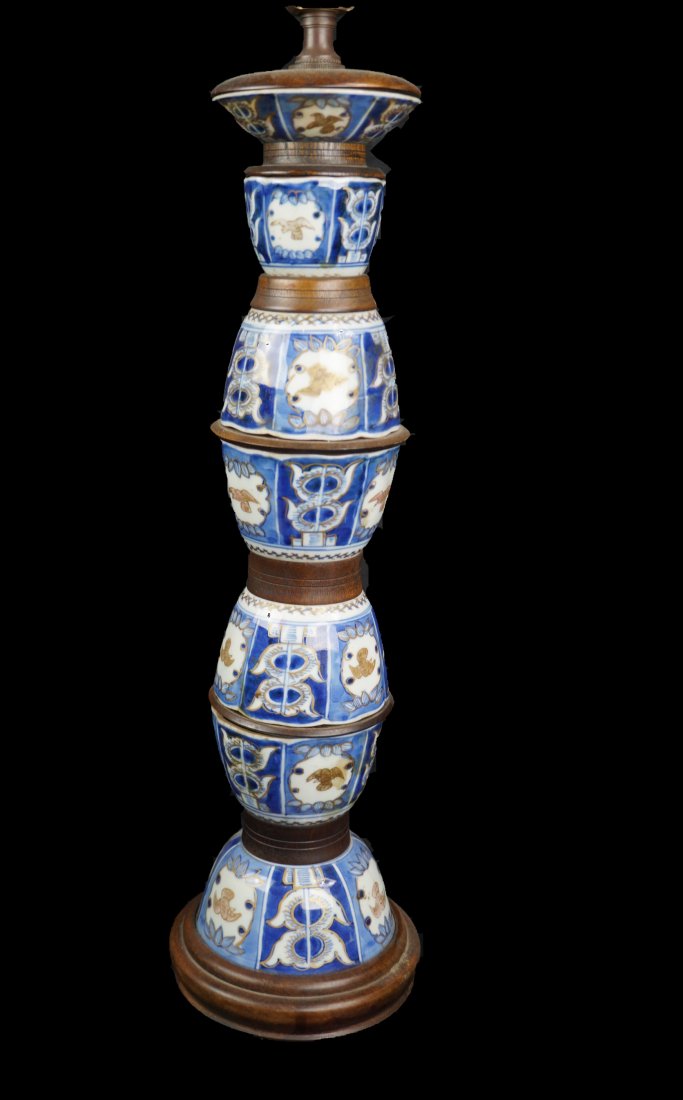 Antique Edo Period Japanese Tea Cup Lamp: Rare and important antique Edo Period Japanese tea cup lamp. Composed of seven pieces of matching hand-painted porcelain cups stacked with wood spacers in between. Measures 28 inches tall.