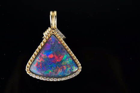 Firey Black Opal Pendant in 14k YG: Large Important Firey Black Opal Pendant in 14k Yellow gold with Brilliant cut diamonds set in a rope pattern setting. 26.9mm at the widests and 24mm tall