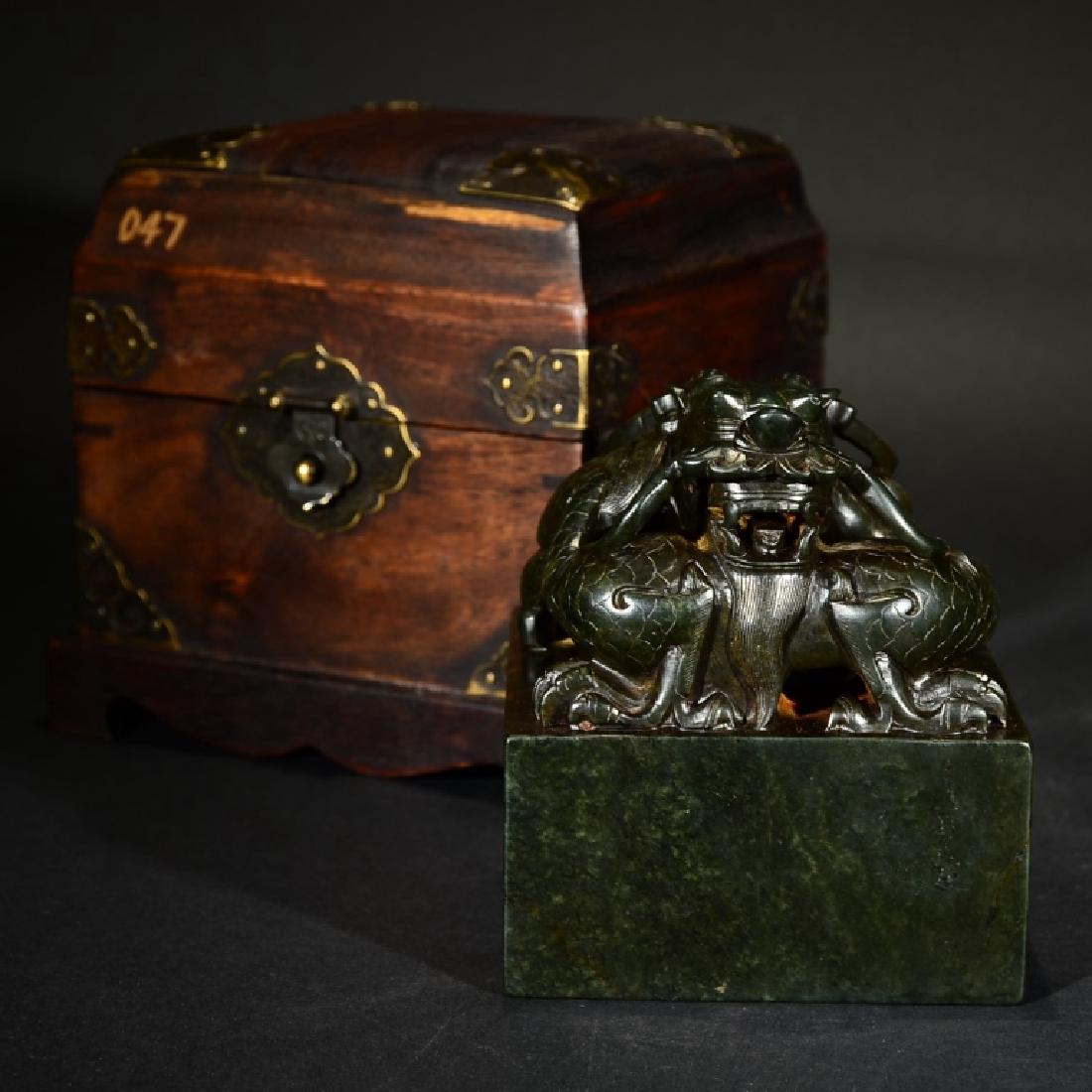 A STONE CARVING 'BISHUSHANZHUANG' SEAL: A STONE CARVING 'BISHUSHANZHUANG' SEAL. 11.2cm x 10cm x 10cm; Good condition. Age discoloured, natural inclusions.