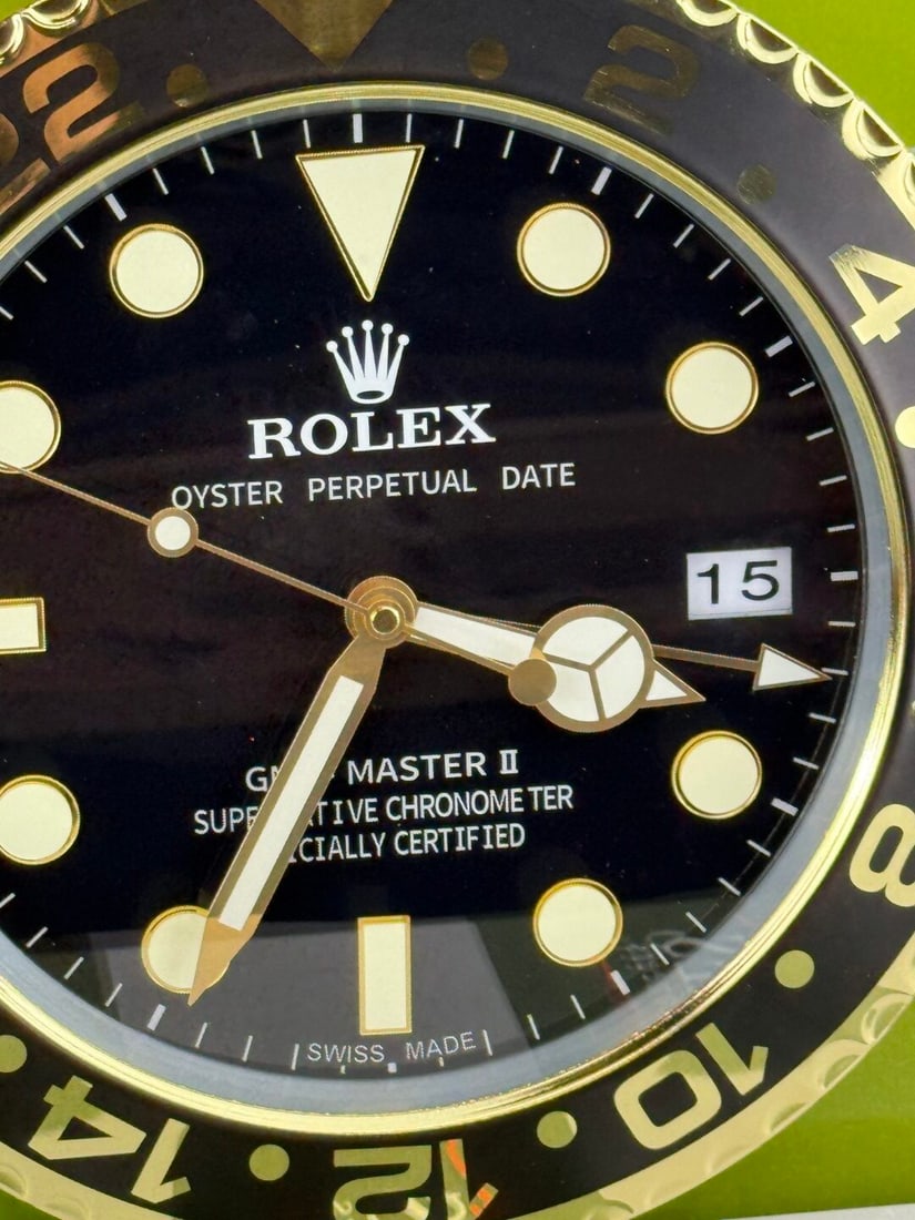 An Advertising Wall Clock Signed Rolex-Black & Gold Classic: An Advertising Wall Clock Signed Rolex-This lot contains 'concessionary' items used as promotional gifts, typically for a trade show. Concessionary items are not manufactured or sold by the brand they