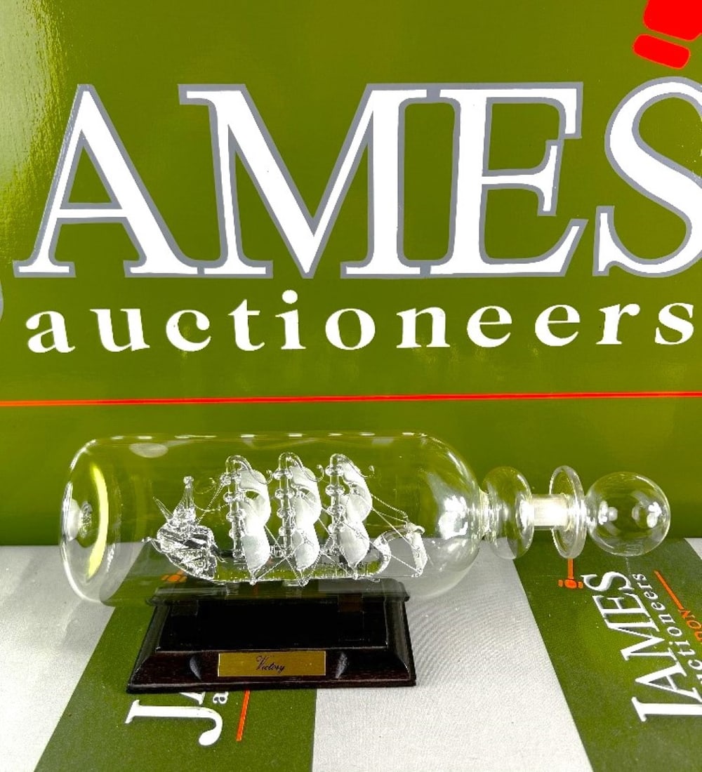 HMS Victory Ship In a Bottle On A Wooden Plinth Display: HMS Victory Ship In a Bottle On A Wooden Plinth Display, dimensions as pictured.