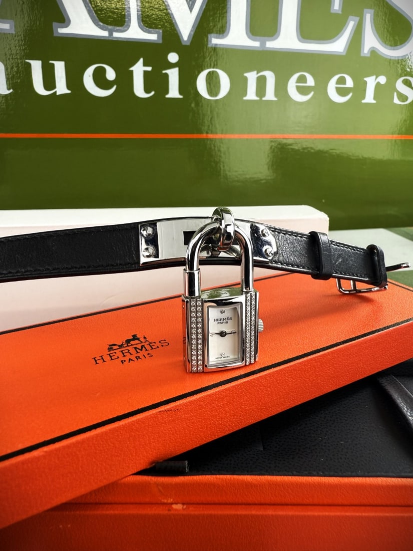 Hermes Paris Factory Diamond Edition Kelly & Double Tour Leather Ref: KE1231: A very rare example of a Hermes Paris Factory Diamond Edition Kelly & Double Tour Leather Ref: KE1231 Quartz movement, mother-of-pearl dial, applied diamond-set quarter numerals, padlock-shaped