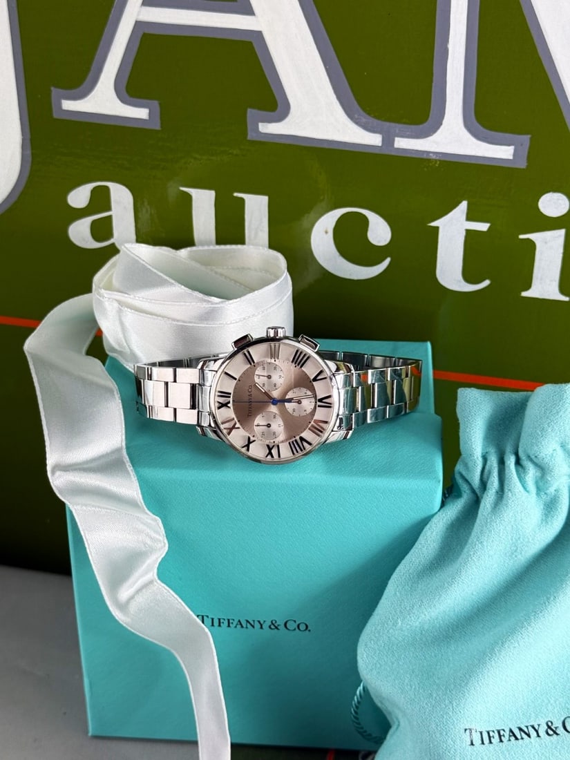 Tiffany & Co Atlas Chronograph Unisex Watch: Tiffany & Co Atlas Chronograph Unisex Watch,Sapphire crystal, Chronograph function, Quartz movement, Water resistant to 50 meters, Swiss made. 37.5 m Bezel, as pictured supplied with Tiffany