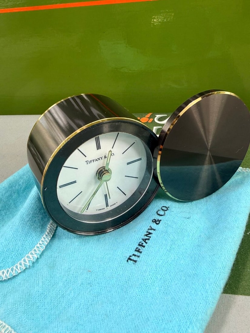 Tiffany & Co Table Top Swiss Made Clock/Alarm Swivel Type Metal Tungsten: Tiffany & Co Table Top Swiss Made Clock/Alarm Swivel Type Metal Tungsten, untested and rare example with original cloth as pictured.