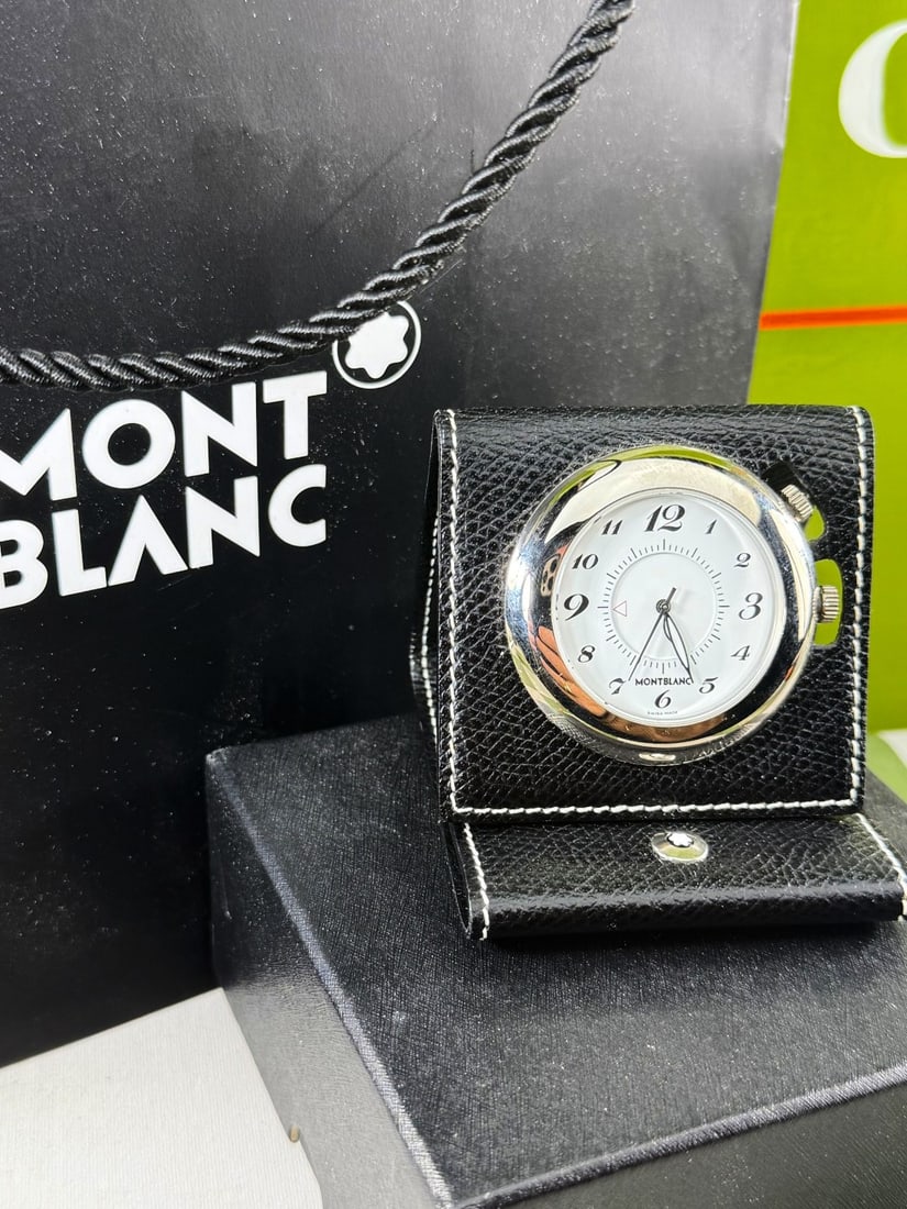 Montblanc Desktop/Travel Alarm Clock In MB Monogram Leather case: Montblanc Desktop/Travel Alarm Clock In MB Monogram Leather case, vendor has had a recent new battery fitted and working at time of lotting. alarm setting not checked.
