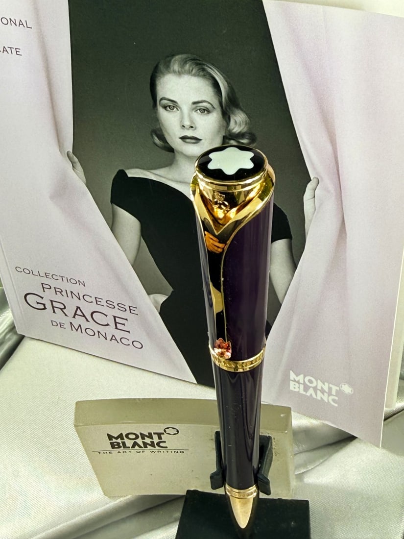 Montblanc Collection Princesse Grace de Monaco Rollerball Pen: Montblanc Collection Princesse Grace de Monaco Pen, mint example, understood to of been instorage for many years. Royal Purple Precious Resin: Features champagne-tone gold-plated fittings and a