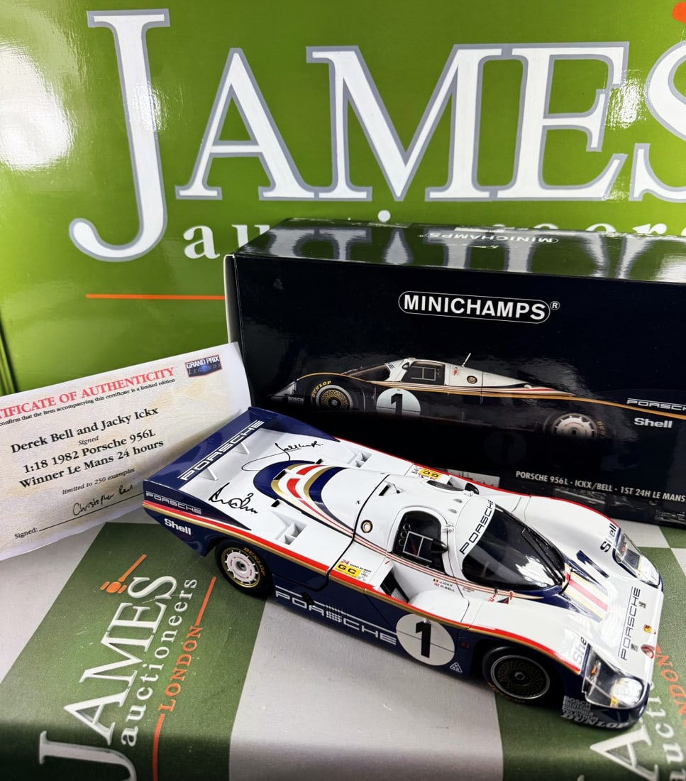 Ltd Edition 1:18 scale Porsche 956L, by Minichamps, Signed by Derek Bell and Jacky Ickx.: A limited edition 1:18 scale Porsche 956L model car, by Minichamps, the car signed by Derek Bell and Jacky Ickx, with CoA, boxed.