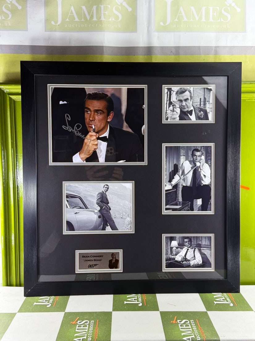 James Bond 007 Interest A Sean Connery Signed Autograph Montage.: James Bond 007 Interest - A Genuine Sean Connery Autograph Montage. signed in silver pen on a photograph of Connery in his iconic role as James Bond. Framed and mounted with four other black and