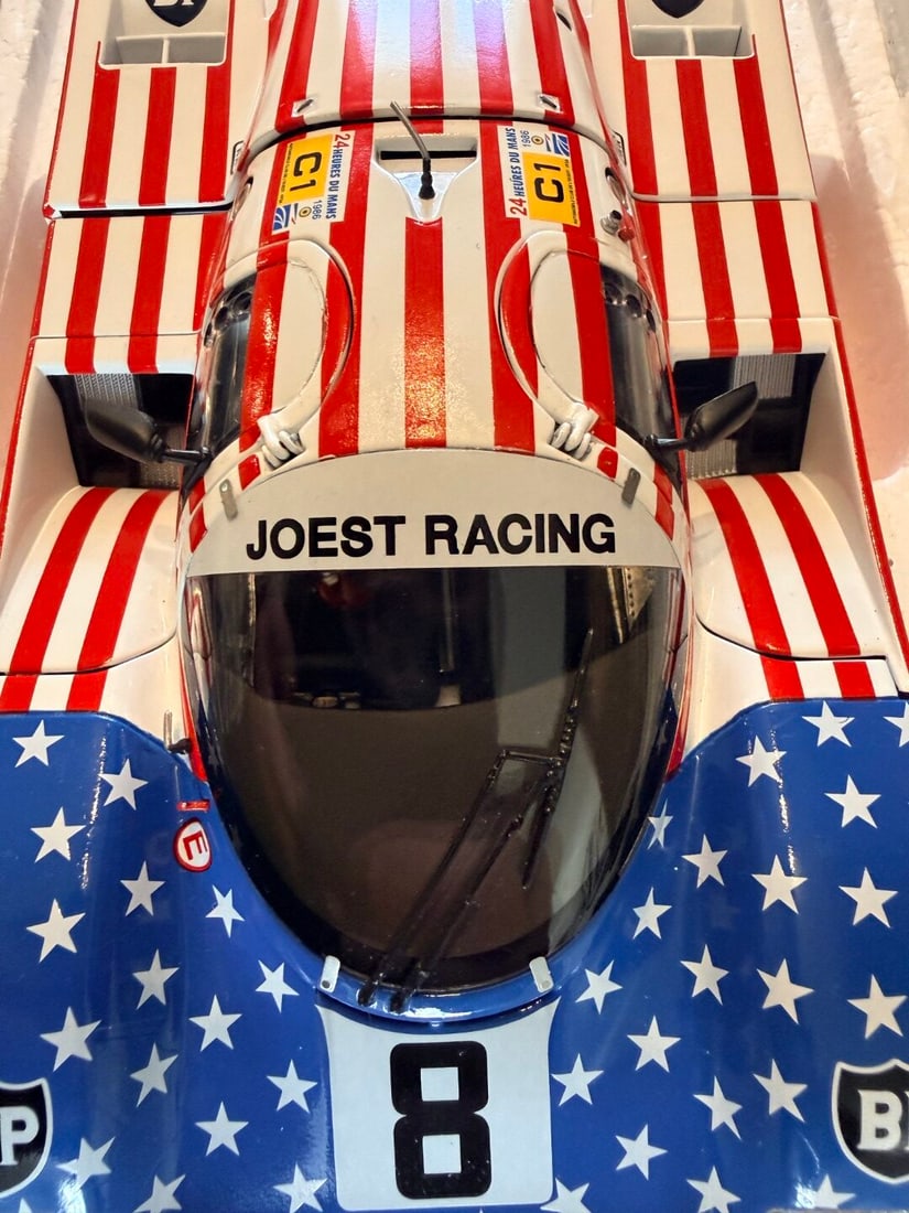 Minichamps 1/18 Porsche 956L Stars & Stripes Follmer/Morton/Miller 24H Le Mans 1986: Minichamps - A boxed Minichamps 1/18 scale #180 866508 Porsche 956L 'Stars & Stripes' Follmer/Morton/Miller 24H Le Mans 1986, complete with original packaging as pictured.