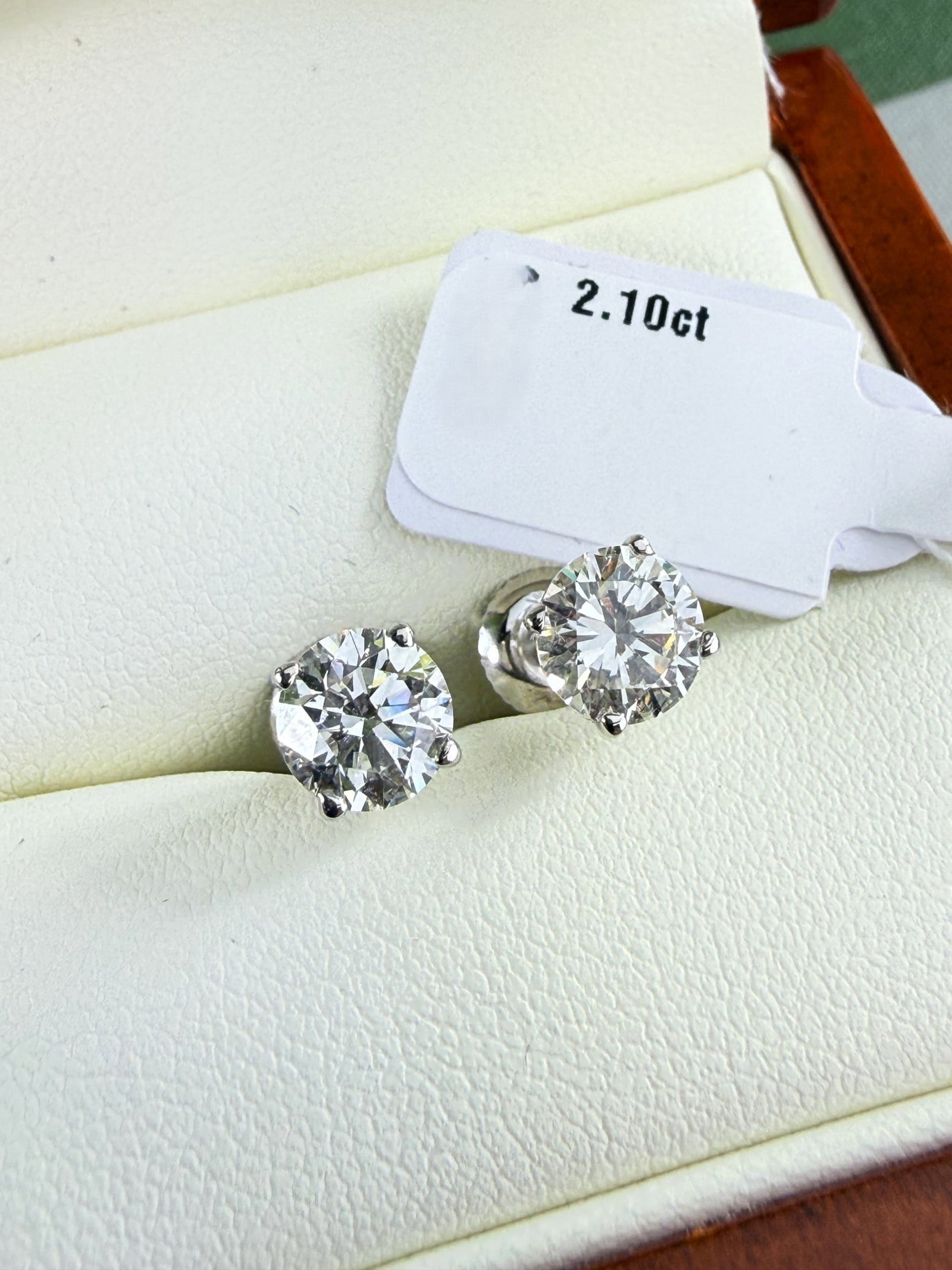 2.10 Carat Round Cut D/VVS2 Diamond Stud Earrings Set In 14 Carat Gold: 2.10 Carat Round Cut D/VVS2 Diamond Stud Earrings Set In 14 Carat Gold, an unworn and new pair of natural 100% diamonds that benefit from having the GIE certification that values the earrings at