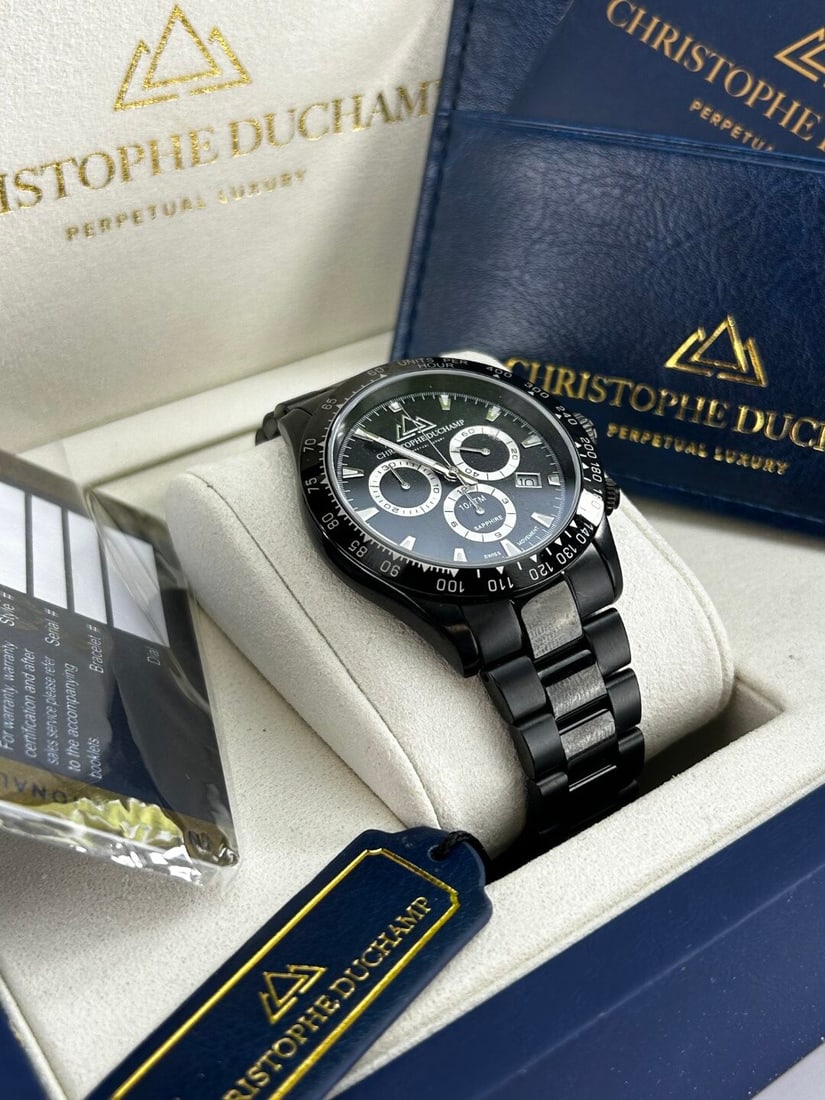 Christophe Duchamp Swiss Movement Grand Mont Gents Watch Ref CD7101-2: Christophe Duchamp Grand Mont Gent's Watch Ref CD7101-2, quartz movement, Oringinal RRp £1750 , mint example as pictured with full box & papers. Watch at time of lotting working however all