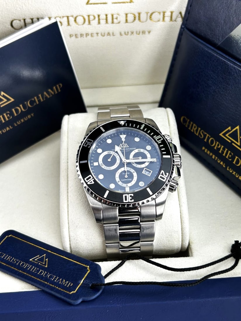 Christophe Duchamp Marine Chrono Gents Watch -Rrp GBP 1795: Christophe Duchamp Marine Chrono Gent's Watch - CD8201-01. mint example original RRp £1795 appears unworn but not verified. As pictured with box and papers.Working at time of lotting however all