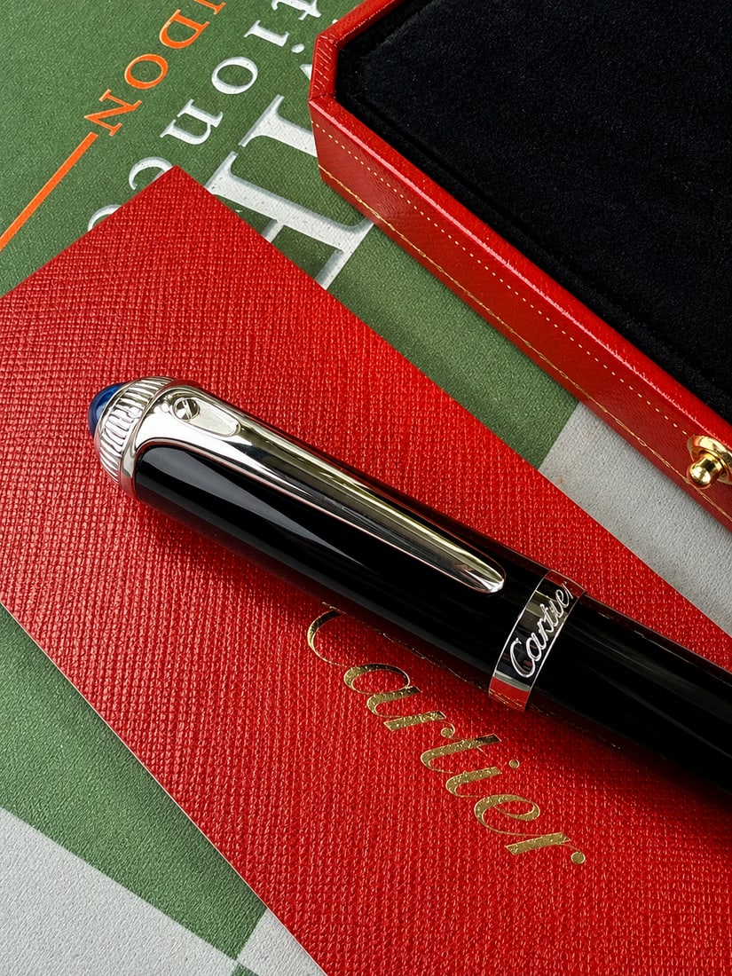 Cartier `R` De Cartier Edition Ballpoint Pen.: Cartier `R` De Cartier Edition Ballpoint Pen Purchased At Harrods London 2010,rare example with original packaging and booklet detailing original purchase etc.R de Cartier ballpoint pen, black composi