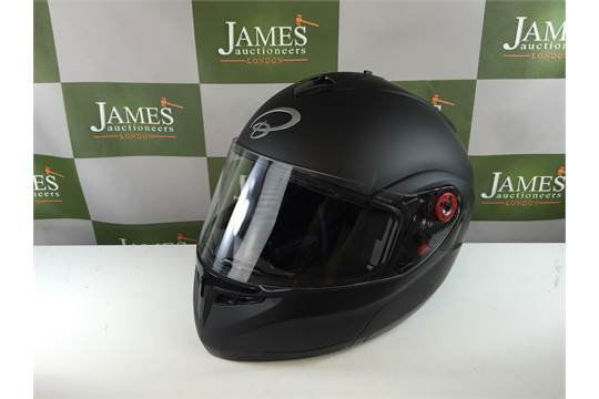 A "Matt Black Carbon" motorbike helmet appears as (1 of 1)