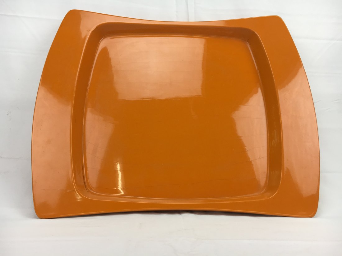 Jens Quistgaard orange lacquer tray for Dansk 1960: Here is a fantastic original Jens Quistgaard orange lacquer tray made for Dansk in the 1960s. It is a rare shape and has the wooden tag on the back. Measures 20" x 16". There are some cracks but no mi