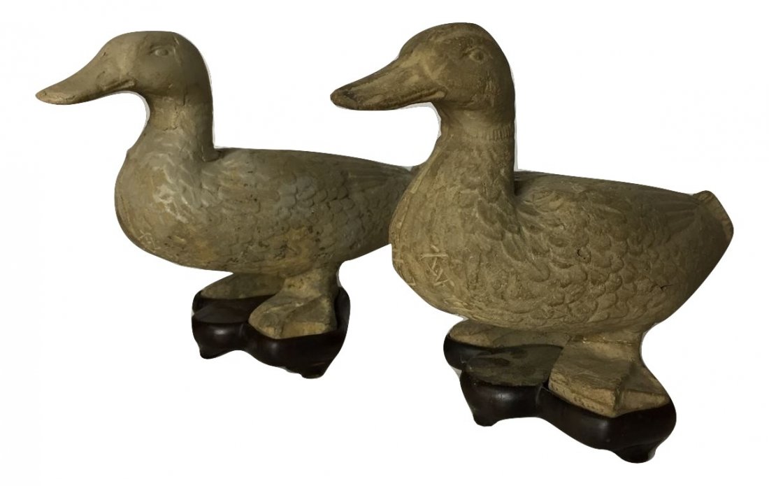 Pair Chinese Western Han Dynasty Terra Cotta Ducks: Pair Western Han Dynasty Chinese duck effigies made of terra cotta. They have Chinese markings on the underbellies and the stands have bee made for them sometime in the 19th century. They measures abo