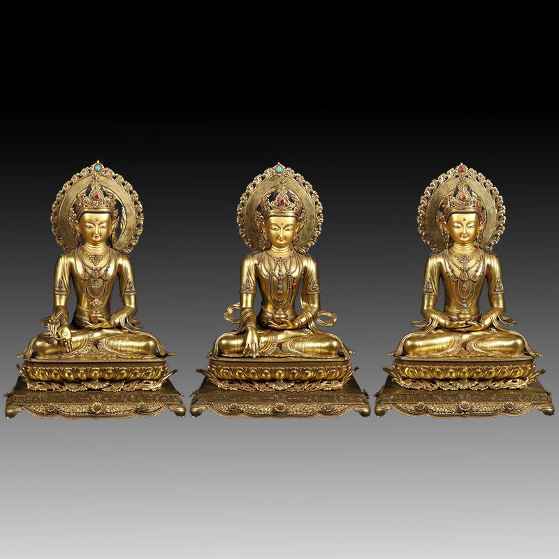 Important set of 3 gilt bronze shakyamuni buddha's: Important set of 3 gilt bronze shakyamuni buddha's Cast in formal in appearance are seated in 'dhyanasana' on a double-pedestal base. Decorated in front with a gilded demi-florette. Dressed in robes,