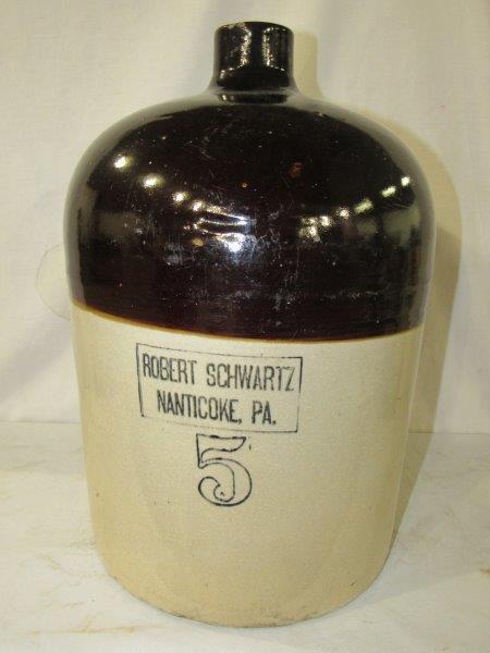 Robert Schwartz 5 gallon stoneware jug: Nanticoke PA. Has a few minor chips on spout few small chips on base otherwise Nice condition. Approximately 17 in tall