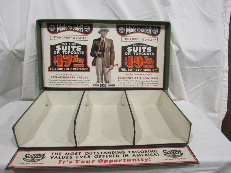 Scotch Woolen Mills tailoring box: Cloth over cardboard box with great original labels inside of lid. 21 in wide 11 in deep 3 1/2 inches high.