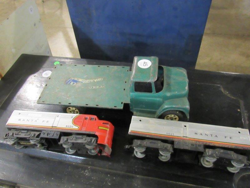 3 piece toy lot: Includes an early metal Ertl truck, Lionel 8020 diesel locomotive and 8021 rail car.