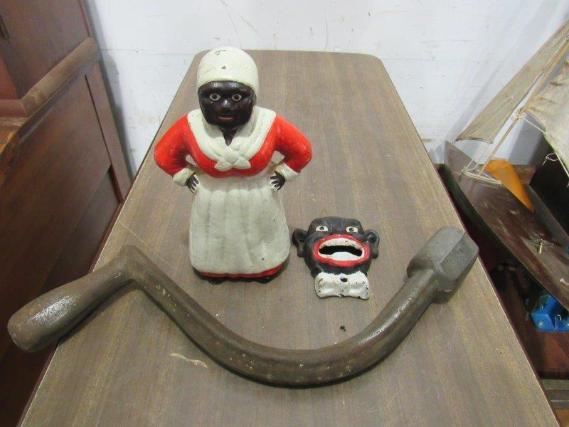2-Cast iron black americana pcs and a hand crank: TBA