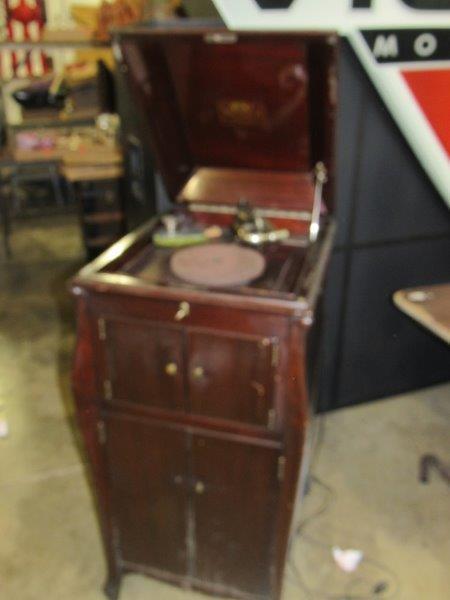 Floor model Victrola: Has been electrified. Works 19 in wide 22in deep 43 in tall