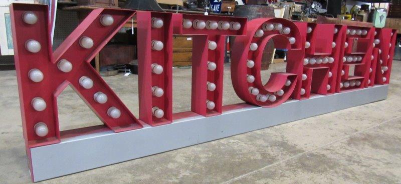 Large KITCHEN light up sign: This is a metal sign with a ton of bulbs. 24 in tall 5 in deep 9 ft long. Does not have a cord.