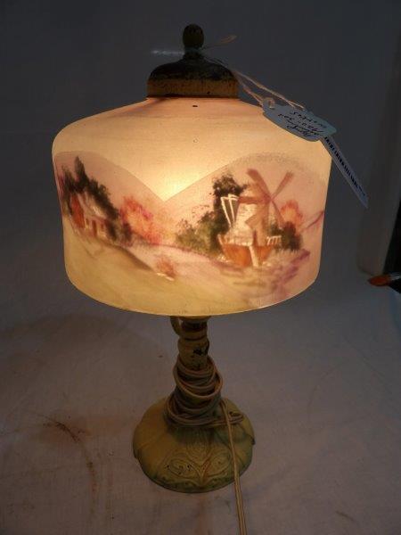 Antique 1920-30s electric lamp: Painted ornate metal base. Glass shade is reverse painted. Works!! Shade is approximately 7 in in diameter, overall height is approximately 14 in.