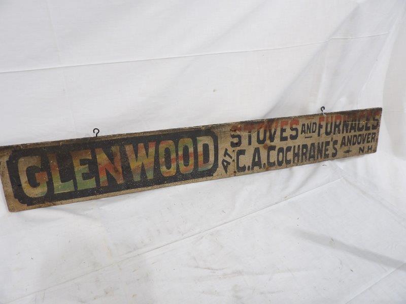 Glenwood stoves and furnaces wooden sign: Andover, New Hampshire. This is one-sided and has a break but is reinforced with another piece of wood attached on back. 6 in x 42 in.