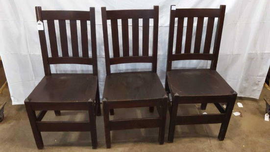 Set of three Arts and Crafts Mission oak chairs: These are signed Heywood Wakefield Co. Chairs show minor wear but overall in solid condition. 18 1/4 in wide 16 inches deep 38 in tall