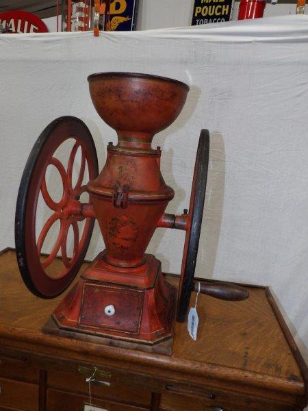 Nice ornate Cresent two wheel coffee mill: Rutland, Vermont. Appears to be in all original state and complete. Does have some fading to paint but overall is solid and has a good look! Wheels are 20 inches in diameter overall height is 25 1/4 i