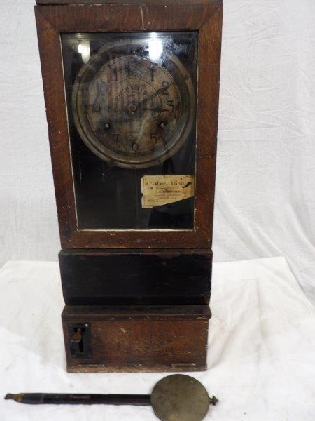 Early Oak Cleveland time clock: Early time clock in a quarter-sawn oak cabinet. Was painted and majority of paint has been stripped, still has areas of some paint. With a Mac Tools label on front door panel. Dial appears to be brass