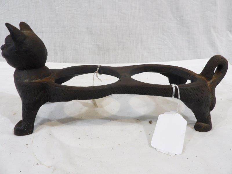 Early cast iron Cat pot holder: Appears to be a pot holder of some kind possibly a spittoon or ashtray?? Has a repair weld in Center and also in rear beside tail. 15 1/2 in Long 6 in wide 6 3/4 in tall.