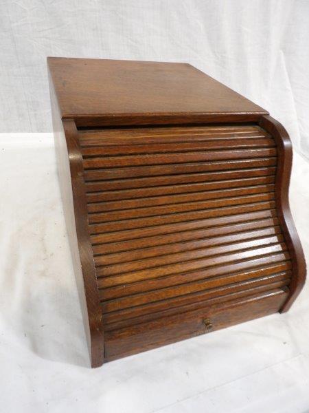 Quartersawn Oak Globe roll top receipt organizer: Early Oak desktop receipt organizer that is Marked Globe, with roll top lid. Also has a small drawer on the interior. Interior is slotted. 10 in wide 16 in deep 8 1/2 inches tall.