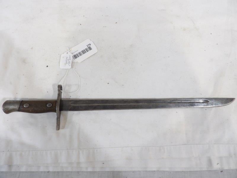 World War I German bayonet: Has some markings on rear of handle. Overall shows wear but is still solid. Blade is 15 1/4 in Long overall length is 19 3/4 in.