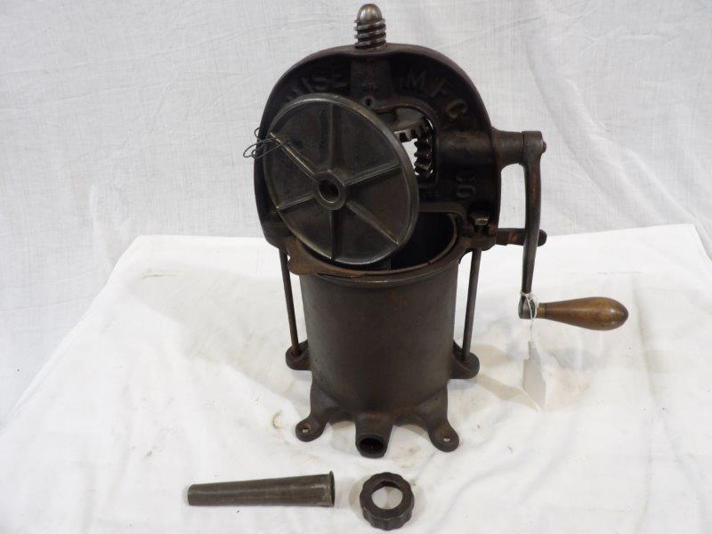 Enterprise Mfg. Co. Complete sausage press: Complete with two plates, spout and colander insert. Shows some wear but overall is still in good usable condition. Approximately 4 quart capacity, 17 in tall.