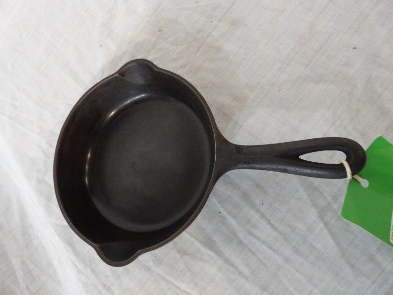 Griswold Erie No.4 cast iron skillet with heat ring: With slant logo. Is in nice and clean condition.