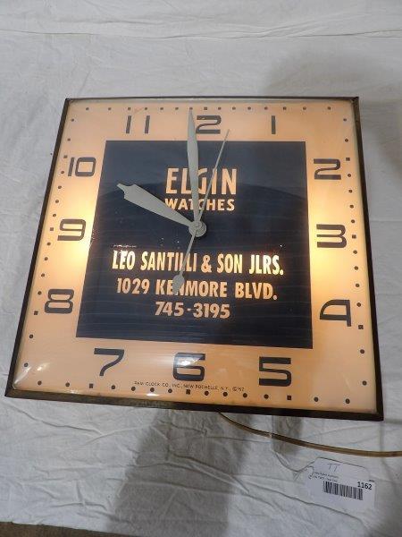 Elgin Watches Pam clock: is and very nice condition and works as it should. 15 in x 15 in.