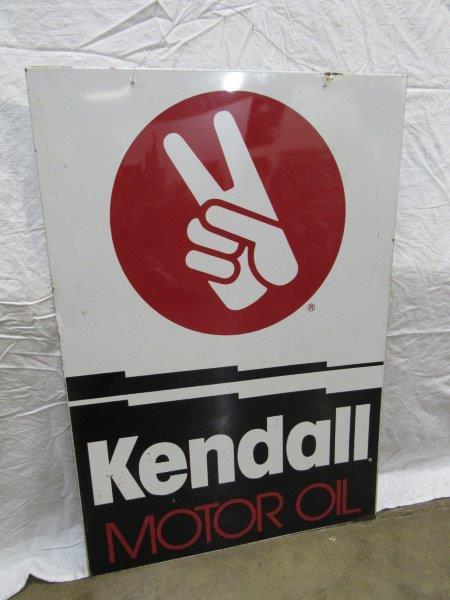 DST Kendall Motor Oil sign: Two-sided tin sign with some scuffing and scratches and minor corrosion along edges but still displays very well! 24 in x 35 in.